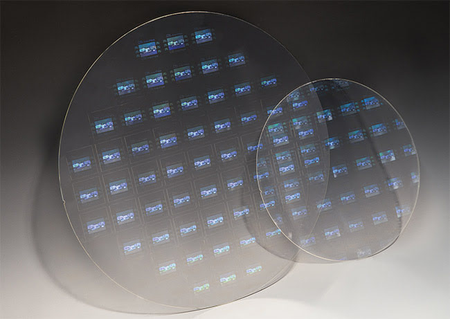 Figure 4. High-refractive-index glass wafers with 200- and 300-mm diameters and nanoimprinted surface gratings. Courtesy of SCHOTT AG.