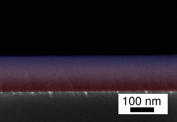 Using an elaborate process, the research team has joined two polymers at the nanoscale in a flowing process: The transition from PV3D3 to Teflon (PTFE) in the scanning electron microscope image of the gradient layer is marked here as the transition from red to blue. Courtesy of Kiel University.