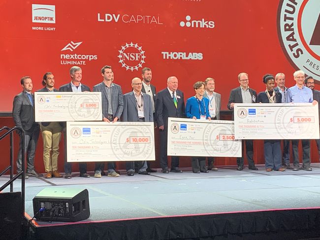 Winners pose for group photo on stage at 10th annual Photonics West Startup Challenge event. Courtesy of Photonics Media.