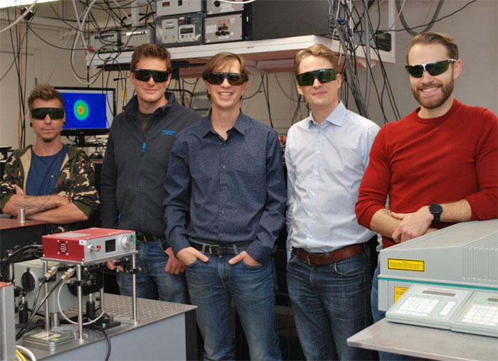 Researchers from Lund University developed an imaging method that provides an unprecedented view of sprays such as the ones used for liquid fuel combustion. Pictured (from the left) are doctoral student Kristoffer Svendsen, postdoctoral researcher Diego Guénot, group leader at the Division of Combustion Physics Edouard Berrocal, group leader at the Division of Atomic Physics Olle Lundh, and doctoral student Jonas Björklund Svensson. Courtesy of Edouard Berrocal, Lund University.