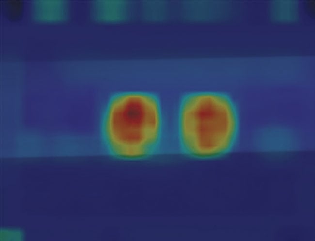 Figure 3. Two defects highlighted with heat maps, which are used to pinpoint the anomaly and visually show the problem. Courtesy of Teledyne DALSA.