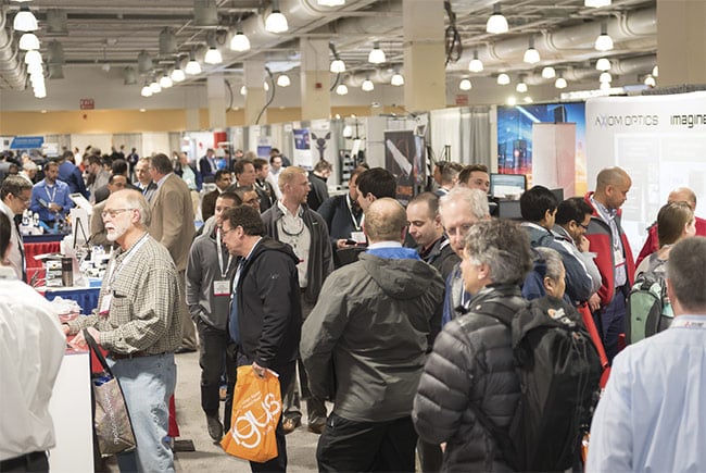 Attendees of The Vision Show 2018 browse the exhibition hall. Courtesy of AIA.