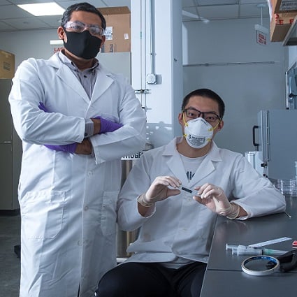 Rice University engineer Gururaj Naik and graduate student Weijian Li have discovered that 2D tantalum disulfide has unique light-handling properties that could be useful for 3D displays, virtual reality and self-driving vehicles. Courtesy of Jeff Fitlow, Rice University.