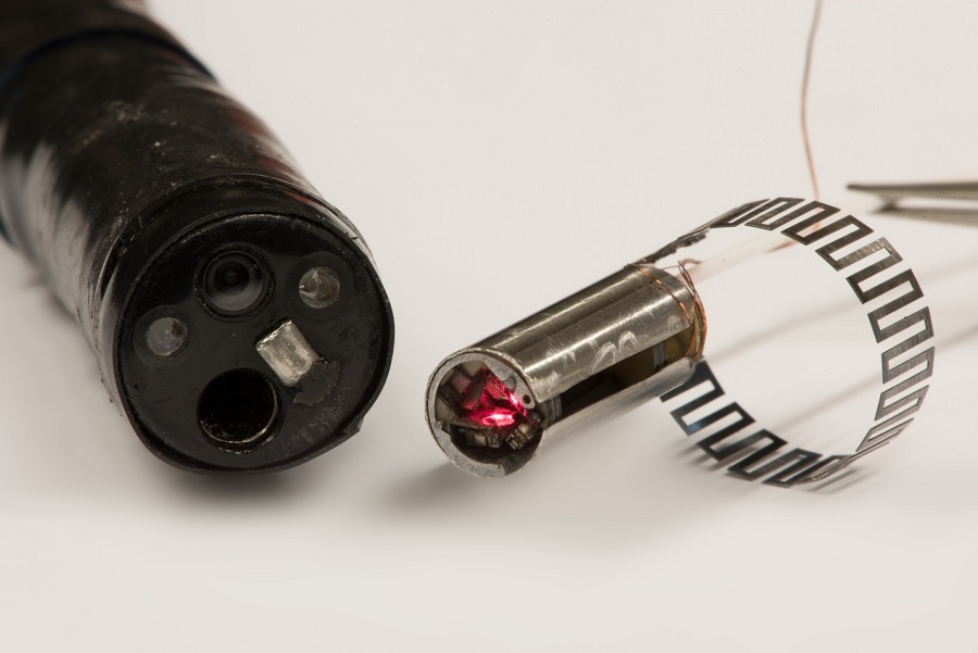 The microrobotic laser-steering end-effector (right) can be used as a fitted add-on accessory for existing endoscopic systems (left) for use in minimally invasive surgery. Courtesy of the Wyss Institute at Harvard University.