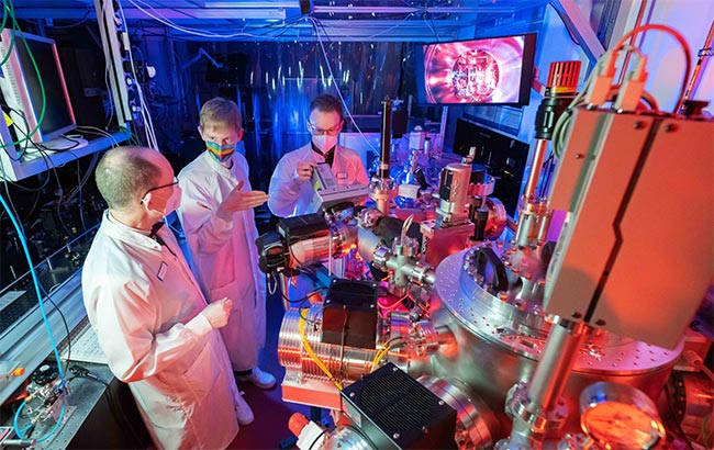 Prof. Dr Gerhard Paulus, PhD student Felix Wiesner and Dr Silvio Fuchs (from left) in a laser lab of the Institute of Optics and Quantum Electronics at the University of Jena. Courtesy of Jens Meyer, University of Jena.