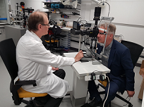 Mario Giardini from the University of Strathclyde tests the cost-effective ophthalmological device. The technology adds on to standard slit lamps that are used routinely by optometrists and ophthalmologists around the world and obtains 3D images of multiple parts of the eye. Courtesy of the University of Strathclyde.