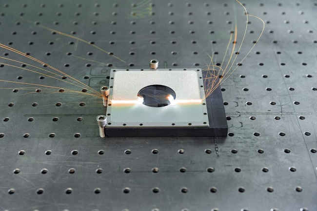The laser blasting system precisely processes only the desired surfaces, consuming neither sand nor material for masking, thus saving hazardous and tape waste. Courtesy of René Jungnickel/Fraunhofer IWS.