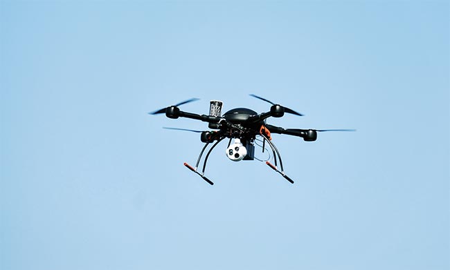 Small form-factor spectroscopy devices can be placed aboard drones and satellites for continuous monitoring of gas emissions. Courtesy of Umicore Coating Services.