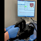 Researchers developed a new, physics-based neural network model that uses terahertz time-domain spectroscopy (THz-TDS) data for noninvasive burn assessment. They combined the new approach with the handheld imaging device shown, which was developed for fast THz-TDS imaging of burn injuries. Courtesy of Stony Brook University.
