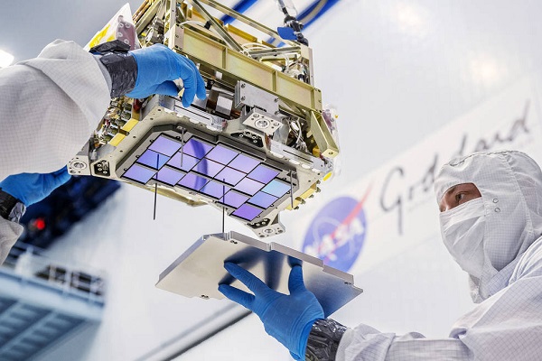 Principal technician Billy Keim installs a cover plate over the detectors for NASA’s Nancy Grace Roman Space Telescope. Courtesy of Chris Gunn, NASA. 