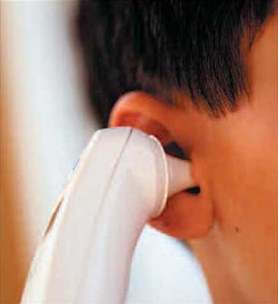 An ear thermometer uses an infrared sensor to determine the temperature of the eardrum.
