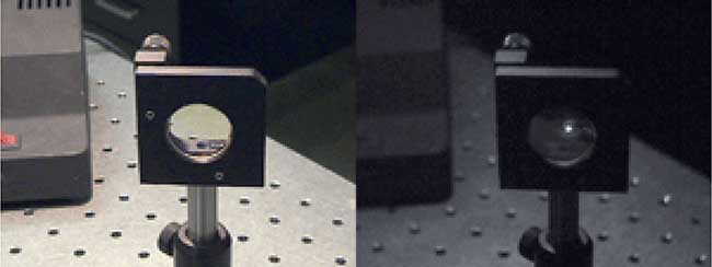 A slightly burned lens with 355 nm laser energy scattering off the burn mark. Left: color, right: near-UV. 