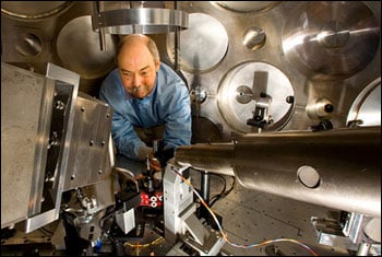 Tom Hurry of Plasma Physics adjusts the target positioner and particle beam diagnostics prior to an experiment at Trident.