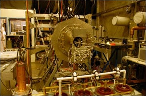 The lab experiment includes a small system that measures plasma for electronics applications, attached to a larger tank containing plasma for energy research.