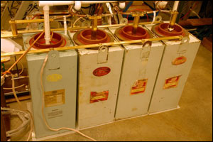 Four capacitors supply up to 10,000 V of energy to separate the xenon electrons from their nuclei, creating an electrically charged plasma. 