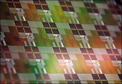 A silicon wafer containing the photonic-electronic microchips designed by the research team, which includes scientists from CU-Boulder, MIT, Micron and UC Berkeley. 