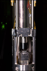 Quantum dot in photonic crystal cavity is placed in an apparatus such as the one shown here, which is then cooled to a few degrees above absolute zero.
