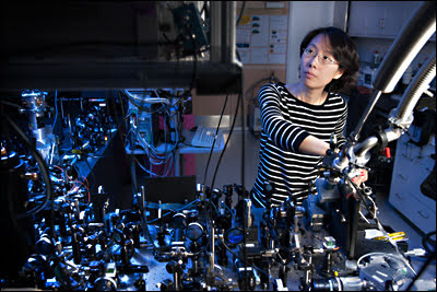 Physicist Na Young Kim, at the optical bench, is a member of the international team that has demonstrated a revolutionary electrically driven polariton laser that could significantly improve the efficiency of lasers. 