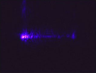 An optical microscope image of second harmonic generation of violet light.