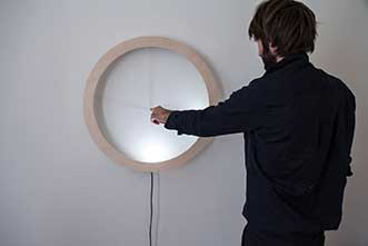 The Shadowplay clock is an interactive LED light art installation by design group breadedEscalope. 