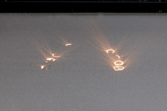 Direct metal laser sintering in action, fabricating multiple-unit bridges.