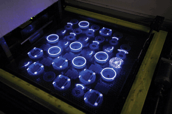 Directed UV laser reacting with the surface of the resin to cure the designs.