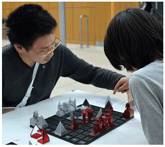 Young students play a game of Khet during the UCD annual science-day event.