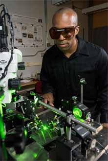 Georgia Tech associate professor Baratunde Cola measures the power produced by converting green laser illumination to electricity using the carbon nanotube optical rectenna.