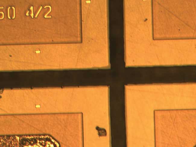 Results of stealth dicing a silicon carbide wafer with a picosecond laser, before mechanical separation of the individual dies.