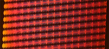 Silicon chip with nanoscale copper plasmonic components. 