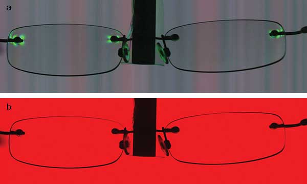  Polarization image (a) compared with a conventional, unfiltered image (b) of a pair of glasses. 