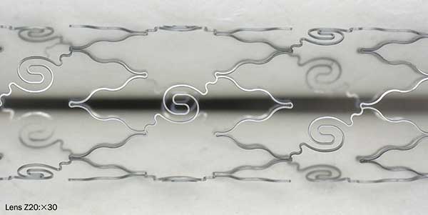 Metal alloy stent made of nitinol machined by femtosecond laser.