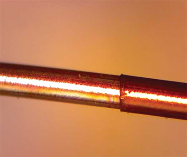 A single-strand single-conductor polyimide-insulated wire stripped with a TEA CO2 laser. OakRiver Technology Inc. 