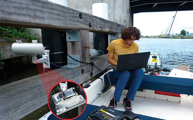 A technician programming the installation on a bridge.