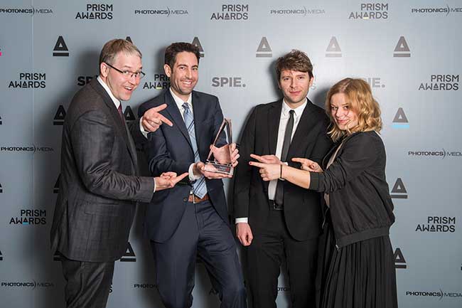 The Crystalline Mirror Solutions team celebrates its 2017 Prism win in the Materials and Coatings category.