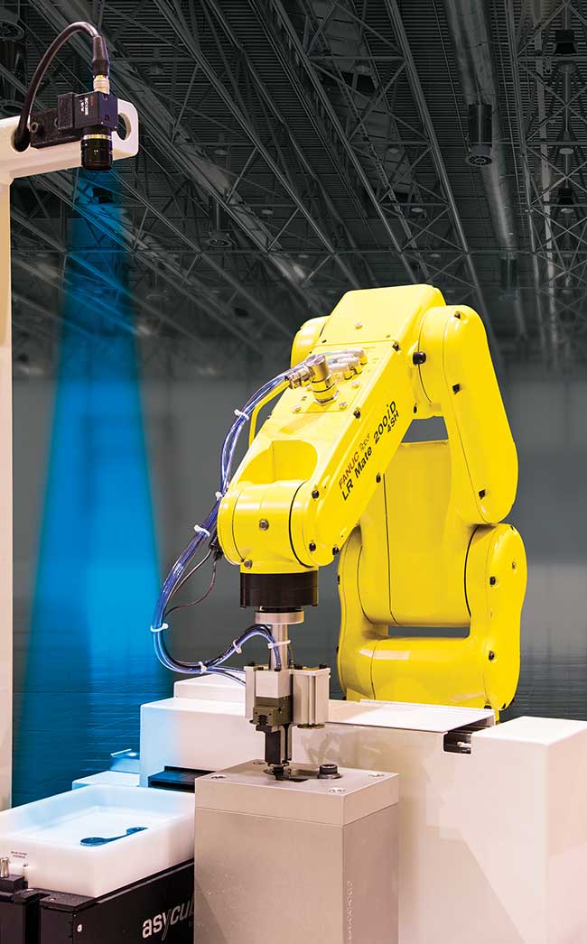 A FANUC LR Mate 200iD robot uses iRVision for high-speed assembly.