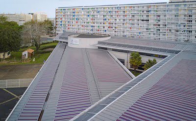 BIOPV roof installation in La Rochelle, HeliaSol on standing seam roof system.