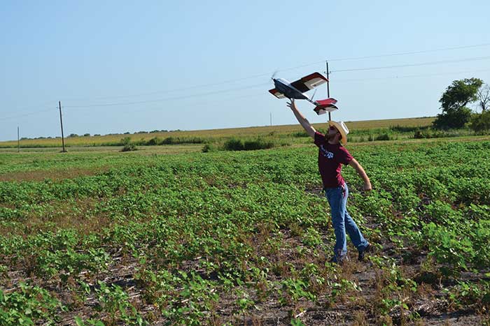 Fixed-wing UAVs are more appropriate for surveying farmers’ fields than rotary wings because they can fly faster and higher, allowing more land to be covered for lower cost. 