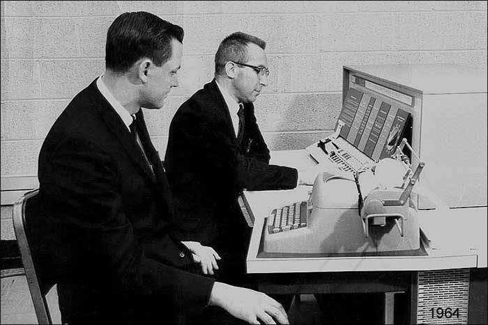 Bruce Walker (left) sits next to his mentor, Donald Kienholz, in 1964.