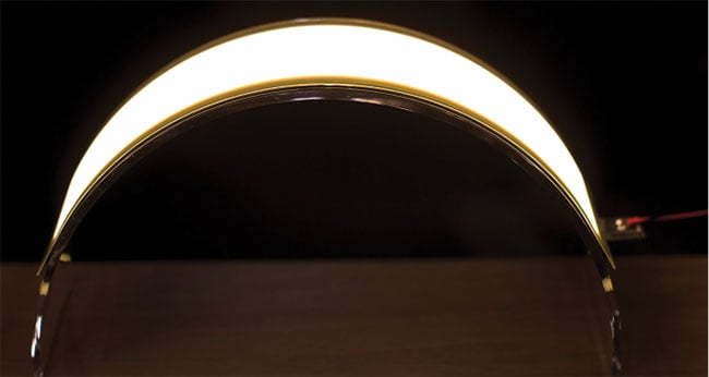 OLED lighting with flexible glass substrates provides thin, curved, space-saving designs with associated low weight. 