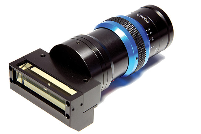 The inspec.x L line-scan lenses from Qioptiq are available with a beamsplitter for coaxial illumination for inspecting highly reflective objects, such as display panel substrates, during various manufacturing phases. Courtesy of Excelitas Technologies.