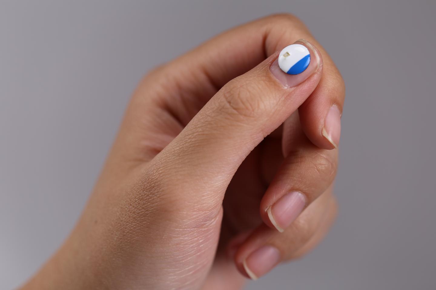 This is a UVA sunlight skin sensor on fingernail. Courtesy of Northwestern University.