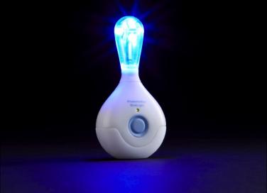 The patented Photomedics BlueLight technology, floods the mouth with light of the appropriate wavelength and intensity, targeting and killing only the harmful, disease-causing bacteria. Courtesy of the Forsyth Institute and Photomedics Inc.