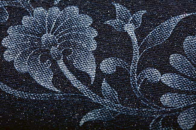 Flower pattern in denim produced by a laser. 