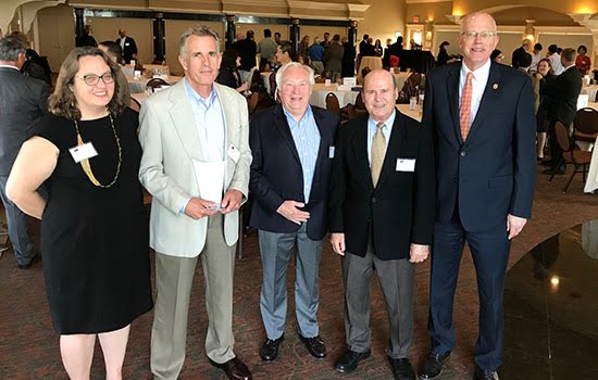 Bruce Smith, professor and director of RIT’s microsystems engineering program, was honored as the 2018 Inventor of the Year by the Rochester Intellectual Property Law Association. Joining Smith (second from left) at the June 12 ceremony were Doreen Edwards, dean of the Kate Gleason College of Engineering; William Bond, director of RIT’s Intellectual Property & Technology Transfer Office; Ali Ogut, RIT professor of mechanical engineering; and RIT President David Munson.