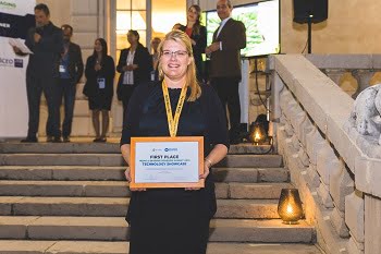 Päivi Sievilä, customer support engineer at Okmetic Oy, accepts the award for MEMS Sensors Technology. Courtesy of SEMI.