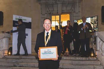 John Hubert, VP of engineering at Alertgy, holds the award for Imaging Sensors Technology. Courtesy of SEMI.