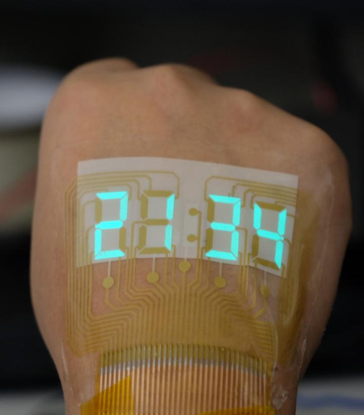 A Stretchable Display Safely Lights Up Human Skin