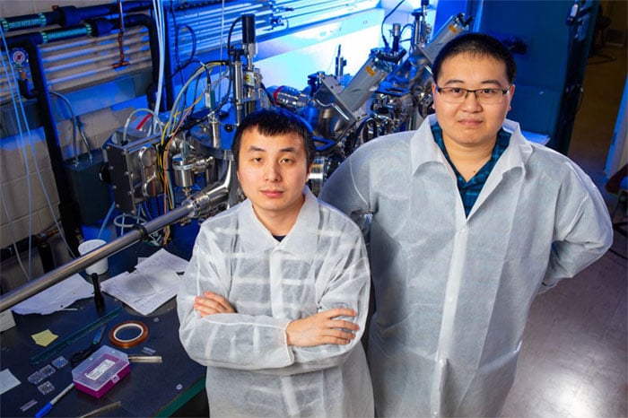 UB physics PhD students Xiucheng Wei (l) and Haolei Hui (r) were the first authors of a new study that reports on the creation of barium zirconium sulfide thin films. The research was led by UB physics professor Hao Zeng. Courtesy of Douglas Levere/University at Buffalo.