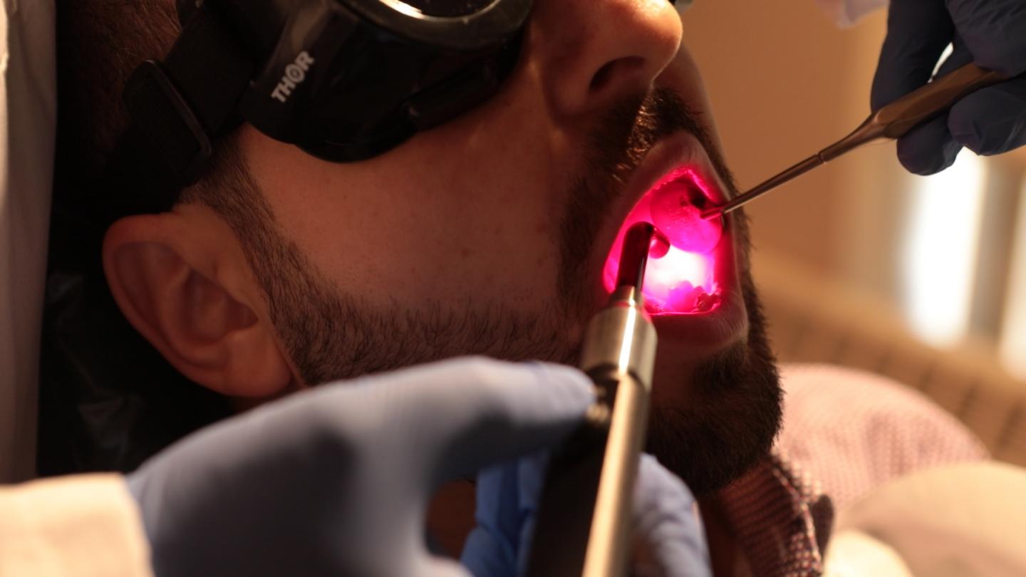 University at Buffalo scientists test light therapy to treat side effects of cancer treatment.